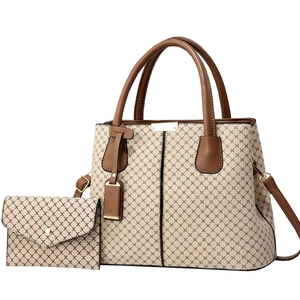 Beige and brown textured tote bag with matching envelope pouch and adjustable strap