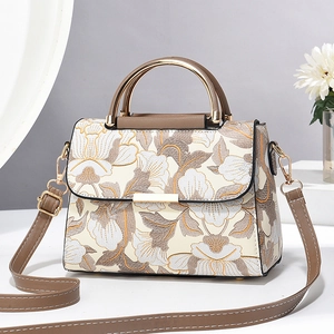 Sac bandoulière élégant à imprimé floral avec poignée dorée et finitions cuir