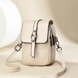 Chic cream mini crossbody phone bag in pebble faux leather with dual zipper compartments