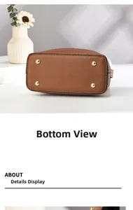 Macro view of brown lychee grain leather handbag bottom with four gold metal studs