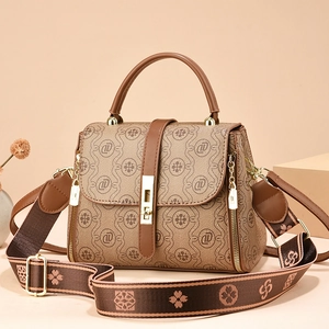 Brown vintage monogram handbag with top handle and wide adjustable crossbody strap