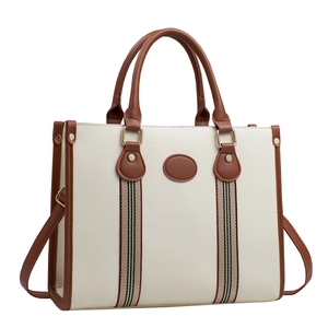 Minimalist off-white leather tote bag with brown handles and striped webbing accent
