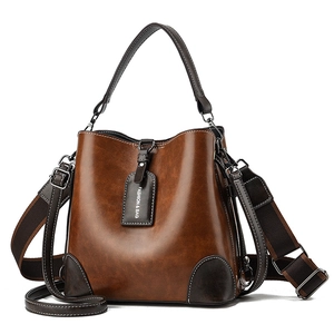Classic vintage brown patchwork bucket bag with elegant wide shoulder strap for women