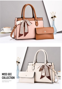 Detailed view of litchi texture leather tote bag set with decorative silk scarf