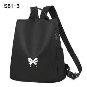 Sac à dos en nylon noir pour femme avec boucle papillon argentée et grande capacité