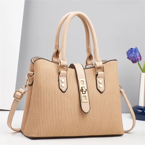 Beige textured PU leather crossbody bag with top handles and golden metal buckle clasp