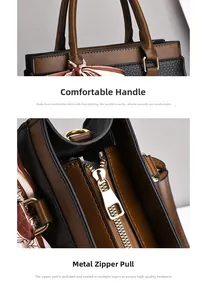 Detail of lychee textured leather handbag with silk scarf handle and gold metal hardware