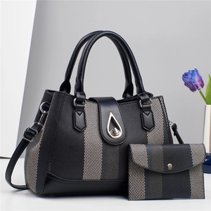 Black PU leather tote bag set for women with woven texture and silver turn-lock closure