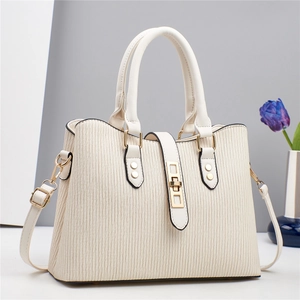 Chic off-white pleated crossbody bag with gold hardware and stylish top handles