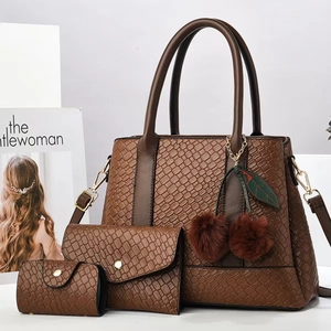 Three-piece brown embossed leather tote bag set with pom-pom charm and chain strap