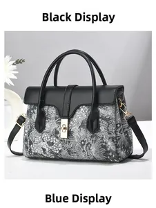 Detail of elegant patterned handbag with gold metal twist lock and dual top handles