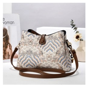 Détail du sac à main vintage à carreaux avec nœud et poignée en cuir en décor intérieur