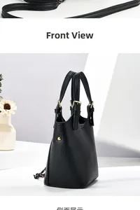 Vue détaillée du sac à main noir en cuir grainé avec boucles dorées et bandoulière