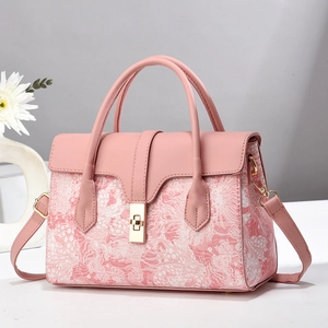Elegant pink floral jacquard crossbody bag with gold buckle and top handle for women
