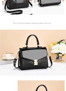 Detail of glossy black crocodile-textured handbag with golden metal flip lock clasp
