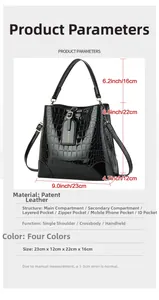 Detailed view of crocodile pattern bucket bag with dimensions and gold hardware
