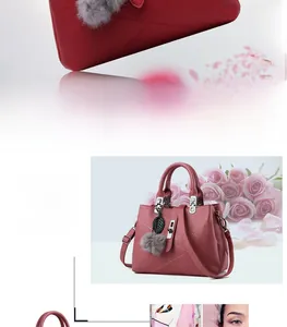 Detailed view of red and pink litchi grain tote bags with decorative fur ball pendant