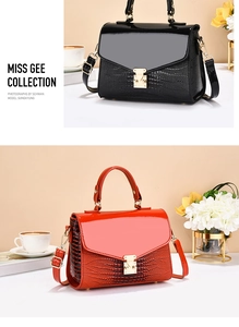 Close-up of stylish faux crocodile leather crossbody bag in black and orange variants