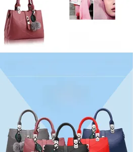 Macro shot of litchi texture leather handbags with leaf pendant and fur ball charm details