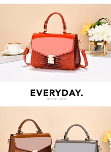 Close-up of patent leather flap and crocodile pattern texture on small women's handbags