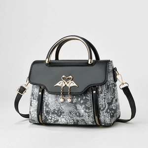 Women's jacquard handbag with swan hardware, pearl charms, and gold handle detail