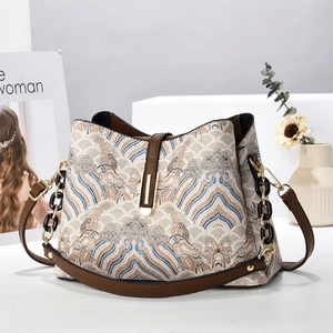 Sac à bandoulière vintage en jacquard pour femme avec finitions cuir et boucle métal