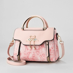 Pink floral tote bag with heart swan buckle, rhinestones and pearls on white background
