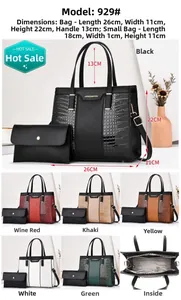 Detail of crocodile pattern tote and pouch set with adjustable strap and metallic logo