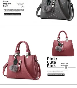 Detail view of pink and grey textured leather handbags with plush ball and leaf charms