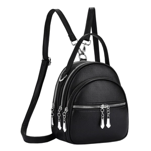 Chic black lychee leather mini backpack for women with silver zippers and top handle