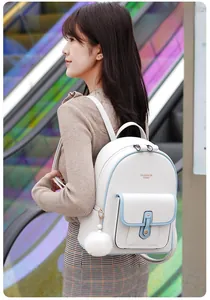 White faux leather backpack for women with light blue trim and a soft pom-pom charm detail