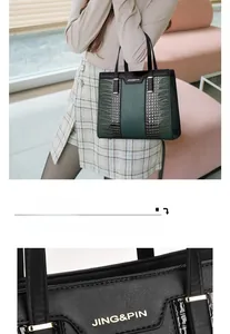 Close-up of crocodile pattern texture and metal buckle on green and black handbag