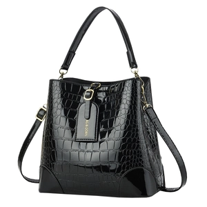 Glossy black crocodile pattern bucket bag with gold hardware and top handle strap