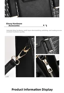 Detail of elegant black handbag showing polished gold-tone hardware and crocodile texture