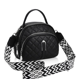 Quilted black leather crossbody bag with dual zippers and wide geometric strap