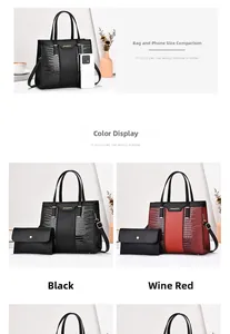 Detail of elegant crocodile-patterned tote and clutch set with gold-tone logo hardware