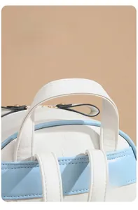Detail of soft blue and white leather backpack with reinforced stitching and gold zipper