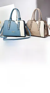 Detail of color-block handbags in blue and khaki with detachable shoulder straps