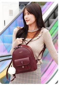 Burgundy PU leather mini backpack with diamond texture and white fur ball keychain charm