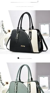 Detail of color-block tote bags in black and green with gold logo and pebble leather