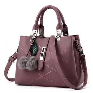 Elegant mauve pebble leather handbag with quilted stitching and silver metal hardware