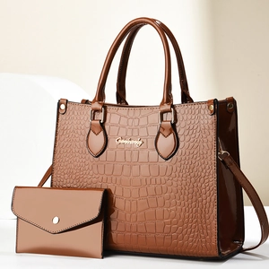 Brown crocodile pattern patent leather tote bag set with a matching small coin purse
