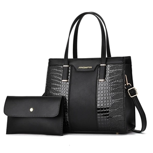 Black crocodile embossed tote bag set with matching clutch and gold-tone hardware