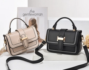 Detailansicht eleganter Handtaschen mit goldener H-Schnalle und Kontrastnähten