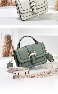 Details von eleganten Handtaschen mit H-Verschluss und breiten floralen Schultergurten