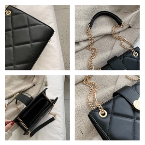 Detail of black quilted shoulder bag featuring gold heart clasp and chain strap textures