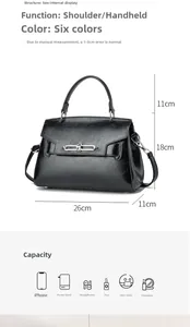 Detailed view of black patent leather handbag dimensions showing 26cm length and metal lock