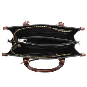 Top view of quilted leather tote bag showing internal compartments and golden zipper