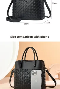 Detailed view of woven leather tote bag dimensions 23x21x11cm with size reference
