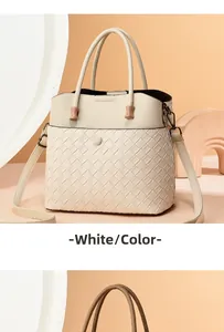 Detail of off-white tote bag showing Intrecciato woven texture and smooth leather finish